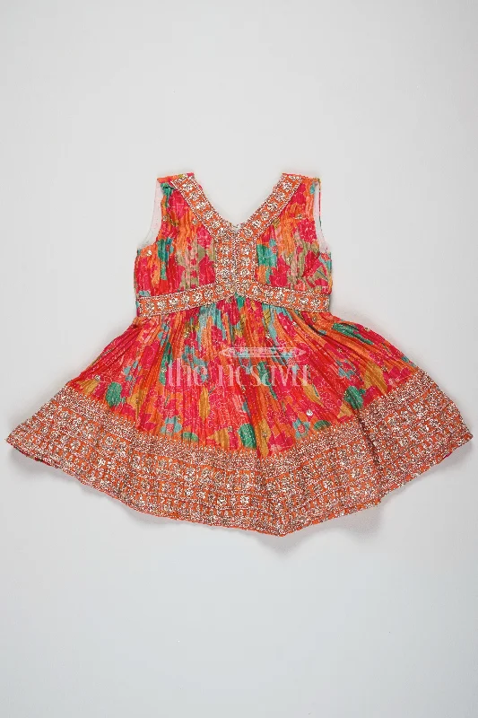 Petite DressOrange Silk Party Frock for Girls – Traditional Pattu Dress with Floral Prints and Sequins Petite DressOrange Silk Party Frock for Girls – Traditional Pattu Dress with Floral Prints and Sequins